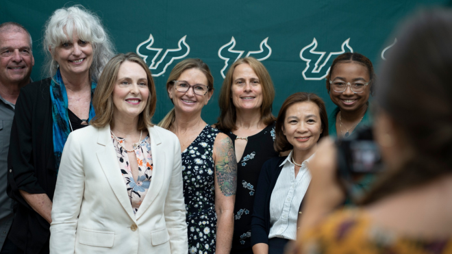 U.S. Congresswoman Kathy Castor gathers for a photo with a group of USF professors and researchers whose work contributes to the TIP Lab.