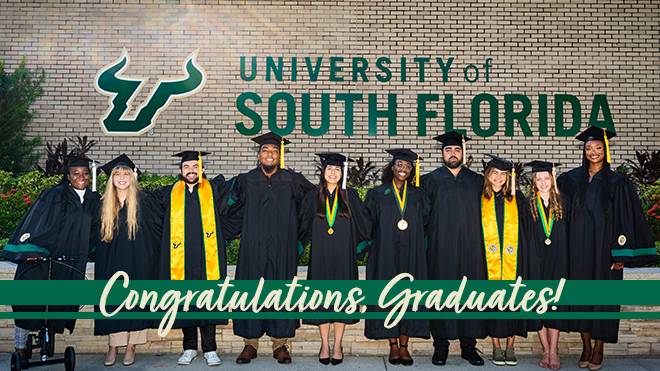 usf graduates line up for a pic outside of SVC building