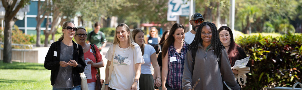 A group of students walking on campus during an event.