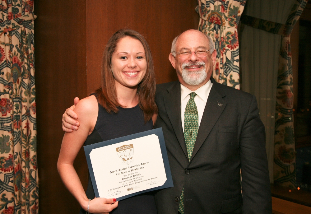 Alumna Samantha Holland Hughes (left) pictured with former CAS Dean Eric Eisenberg (right) at the DSLS induction ceremony in 2015. (Photo courtesy of DSLS)