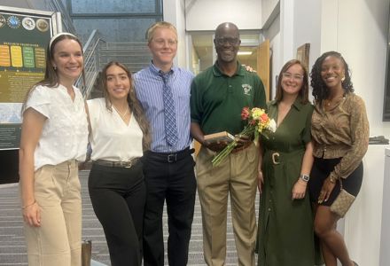 Some PIACCART undergraduate students with their program mentor, Dr. Richard Mbatu at REU poster symposium. (Photo courtesy of Christina Cummings)