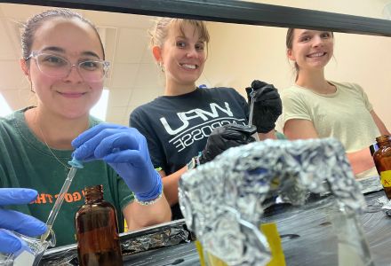 PIACCART students transferring extracted samples into bottles. From left to right, Katherin Abreus Rodriguez, Mary Langer, and Katherine Hallee. (Photo Courtesy of Katherin Abreus Rodriguez).