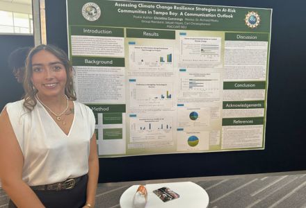 Christina Cummings with her research findings at the REU poster symposium (photo courtesy of Christina Cummings)