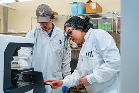 Neda Latifi, assistant professor of medical engineering, works with undergraduate student Russel Kramer [Photo by Torie Doll, University Communications and Marketing]