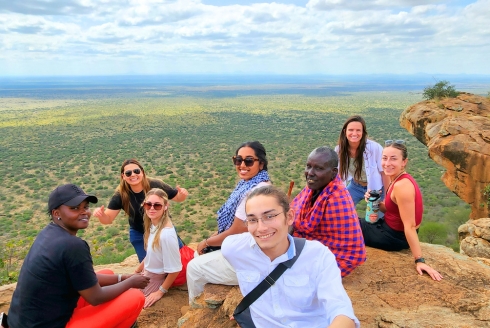 Students enjoying ‘lunch with a view’ from an outlook in Mbrikiani Ranch, Kajiado County, Kenya. They made the trek with a Maasai man who brought them there when we they asked him for a nice spot to have lunch. (Photo courtesy of Dr. Dillon Mahoney)