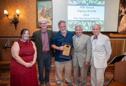 Arminda Mata (left) posed with USF librarian and Anthony “Tony” Pizzo Award recipient, Andy Huse (center) at the 40th Annual Legacy Award Ceremony for the Ybor City Museum Society. (Photo by Corey Lepak)