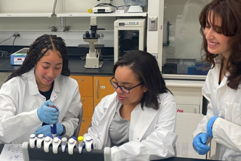 Freedom High School students engage in a pipetting activity in the genetics laboratory, offered to USF undergraduates in the cell and molecular biology major. (Photo courtesy of Sandy Westerheide)
