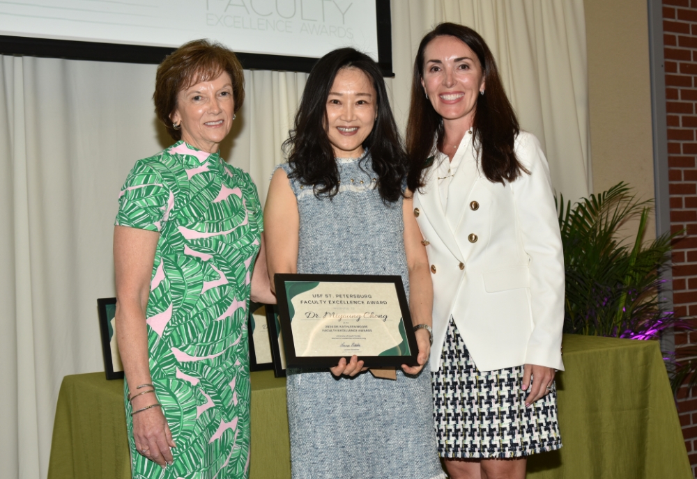 Dr. Miyoung Chong (center) is a recipient of the WLP’s  2024 Dr. Kathleen Moore Faculty Excellence Award. (Photo courtesy of Miyoung Chong)