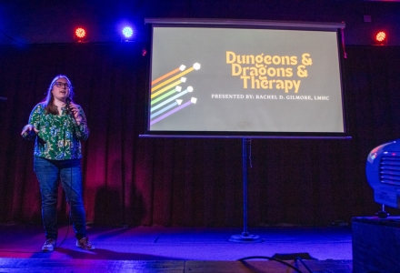 USF alumna, Rachel Gilmore, presenting the use of Dungeons & Dragons in therapy at the New World Brewery’s Pints of Science event. (Photo courtesy of Rachel Gilmore)