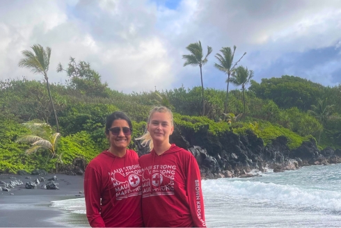 Dougherty (left) and Kaila Witkowski, an assistant professor at Florida Atlantic University, at the black sand beach with Maui Strong sweatshirts that they purchased from Brown Kross Hui (BKH), a grassroots organization. The funds from these shirts go directly to support BKH's efforts to get displaced families’ furnishings in the homes they have been able to obtain. (Photo courtesy of Ratna B. Dougherty)