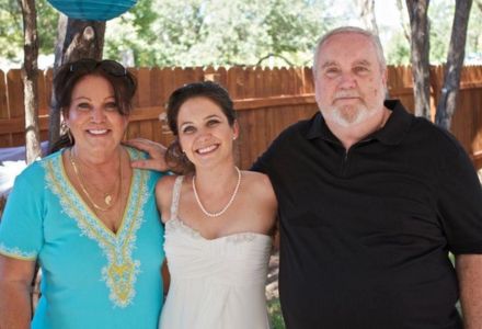 Bowman stands between her mother and father at her wedding in 2011 in Austin, TX. (Photo courtesy of Meghan Bowman)