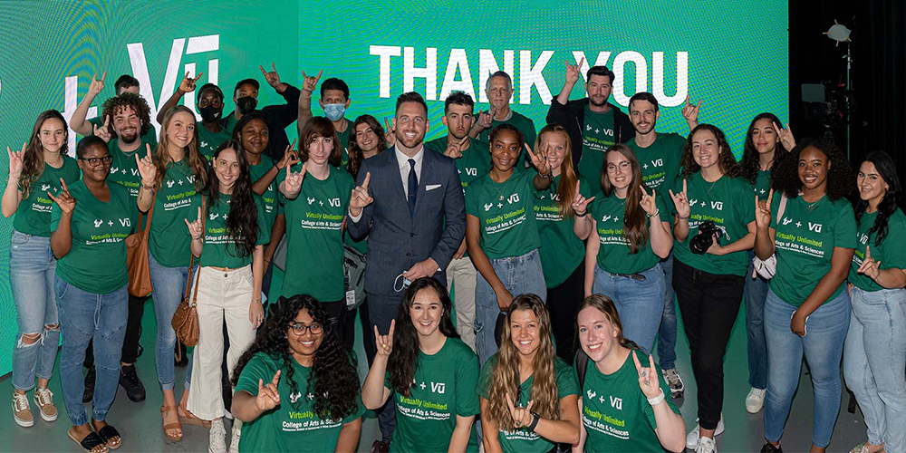 Moore and a group of students from the Zimmerman School of Advertising and Mass Communication during the unveiling of Zimmerman's new Vū studio space in 2021. (Photo courtesy of USF Foundation)