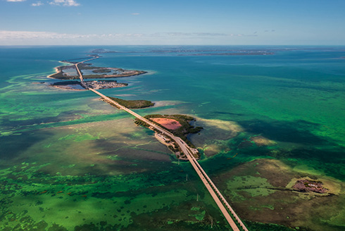 causeway between small islands surrounded by shallow water