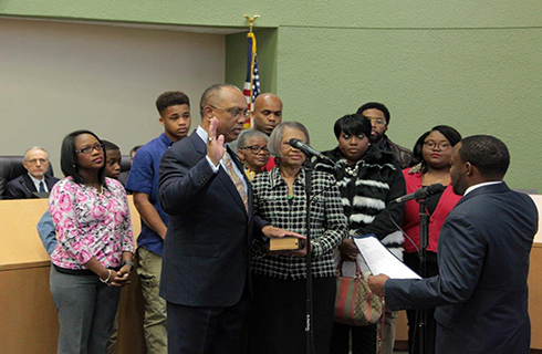 Miller being sworn in as County Commissioner in 2010.