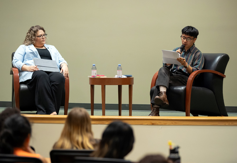 Humanities Institute director Elizabeth Kicak (left) with poet Ocean Vuong (right) during the Institute's latest poetry reading in November. Photo by Corey Lepak.