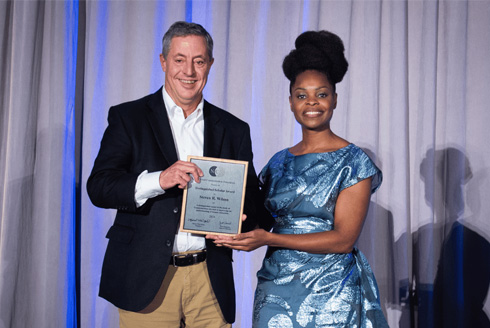 Steven Wilson (left) was formally recognized at an awards ceremony at the National Communication Association (NCA) annual meeting in New Orleans this past November (2024). Wilson is pictured with Dr. Marnel Niles Goins, NCA President and Dean of the School of Communication at American University. The Distinguished Scholar Award is the highest award given by NCA. Wilson delivered a short talk about his career at the meeting and thanked those who have mentored and supported him over the years. “I look forward to continuing to pass that on to the graduate students I work with now,” he said. (Photo courtesy of Dr. Kai Kuang)