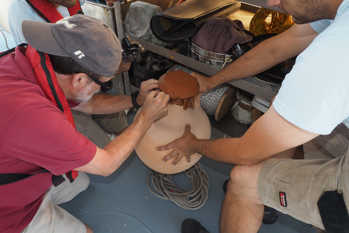 Murray securing amphora cap