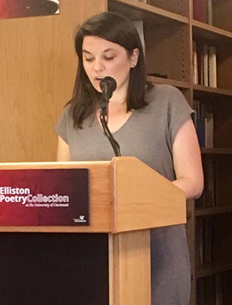 Julia Koets reading at lecturn