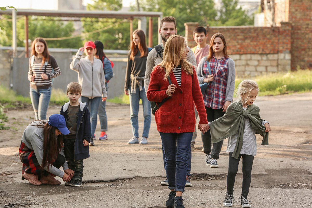 group of adults and children walking