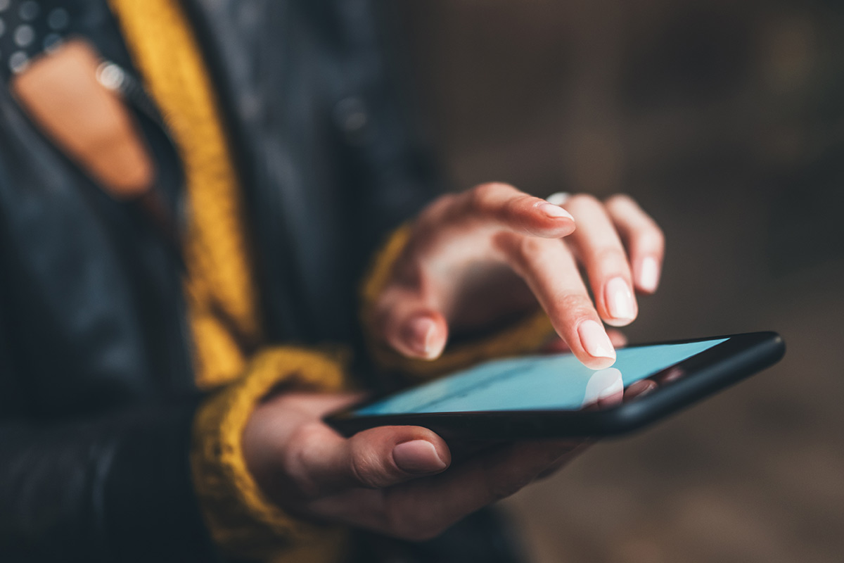 person touching smartphone screen