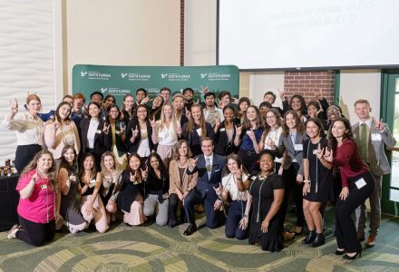 New, current, and graduating DSLS students show their USF Bulls pride with Dean Michael and Admiral Kirby. (Photo by Marc Edwards Photographs)