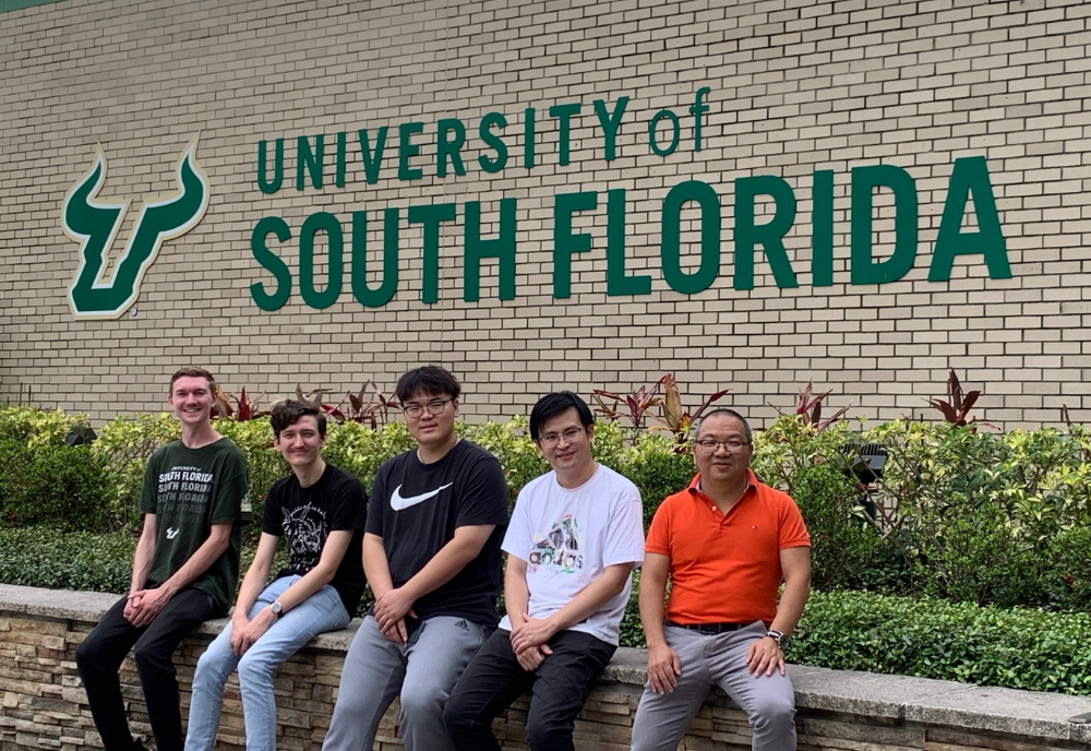 Dr. Libin Ye (far right) with lab members (from left) Seth Brady-Johnson (undergraduate), Aidan McFarland (doctoral student), Yifei Sui (undergraduate), Xudong Wang (doctoral student). All students are majoring in degree programs from the USF CAS Department of Molecular Biosciences (Photo courtesy of Dr. Ye)