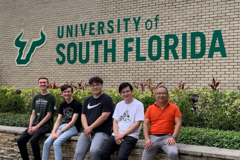 Dr. Libin Ye (far right) with lab members (from left) Seth Brady-Johnson (undergraduate), Aidan McFarland (doctoral student), Yifei Sui (undergraduate), Xudong Wang (doctoral student). All students are majoring in degree programs from the USF CAS Department of Molecular Biosciences (Photo courtesy of Dr. Ye)