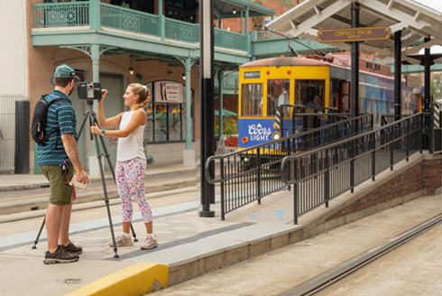 Students Sean Wissler (left) and Amber Brocki (right) laser-scan the HART TECO streetcars at Centro Ybor Station. (Photo by Alessandra Casanova) 