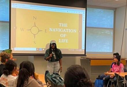 CAS student Jailynn Youmas delivering a motivational talk to high school students as they visited USF during last year’s I Belong: USF Week. Many of the visiting students were AP chemistry and engaged citizenship students at Freedom High School. (Photo courtesy of Dr. Sandy Westerheide)