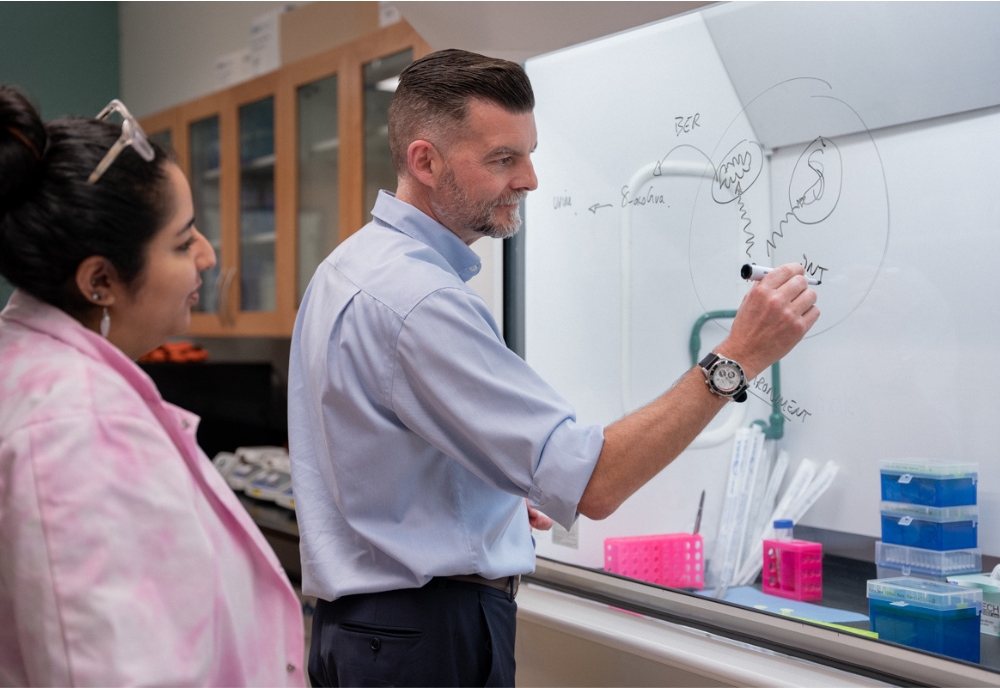 Marcus S. Cooke, PhD, FRCPath, (right) serves as chair of the department. (Photo by Alessandra Casanova)