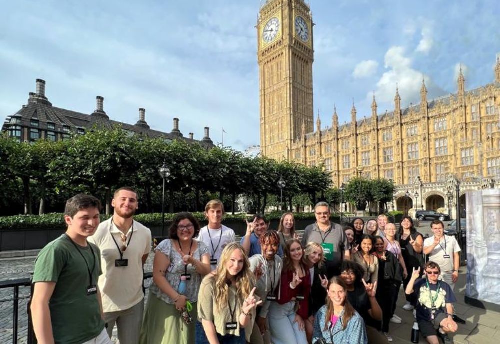 Director Scott Solomon, and students, standing outside of the Parliament building in London. (Photo courtesy of Elena Efremova)