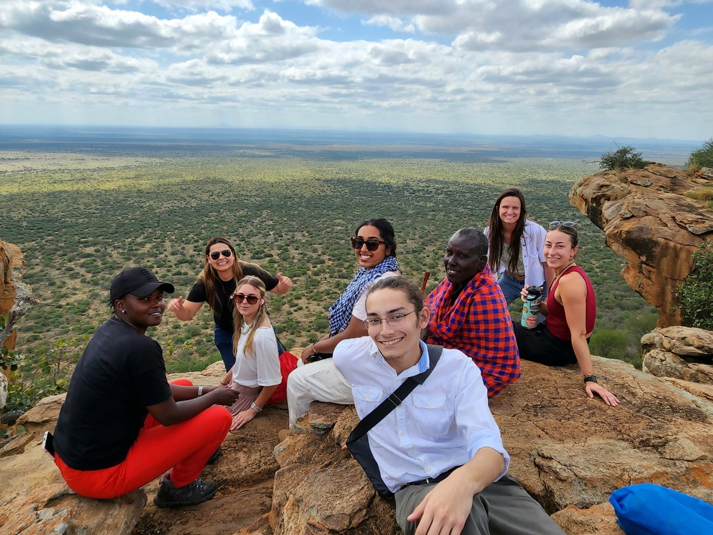 Students sit at an overlook in Kenya