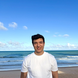 Lucas standing on beach