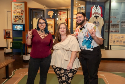 Arminda Mata (middle), CEO of the Ybor City Museum Society, along with Rose Lopez (left) and Matthew Lewicki (right), two former history major interns who are now employees. (Photo by Corey Lepak)