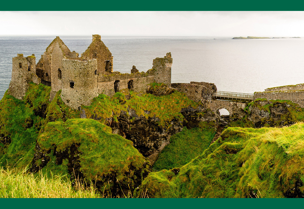 castle ruins on cliffside in Ireland