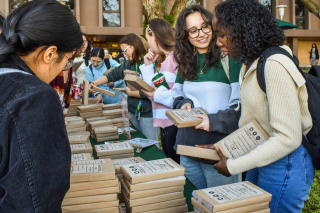 Students picking out a free book