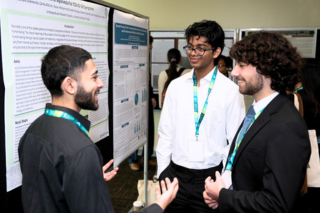 Students talking at poster session