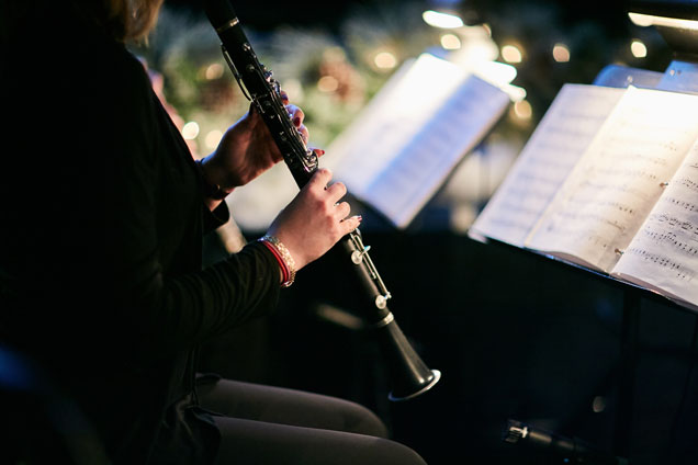 Musician performs with a clarinet.