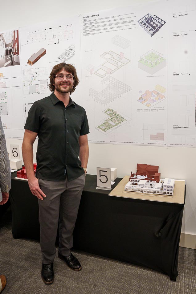 Daniel Mariani poses next to his Architecture project.