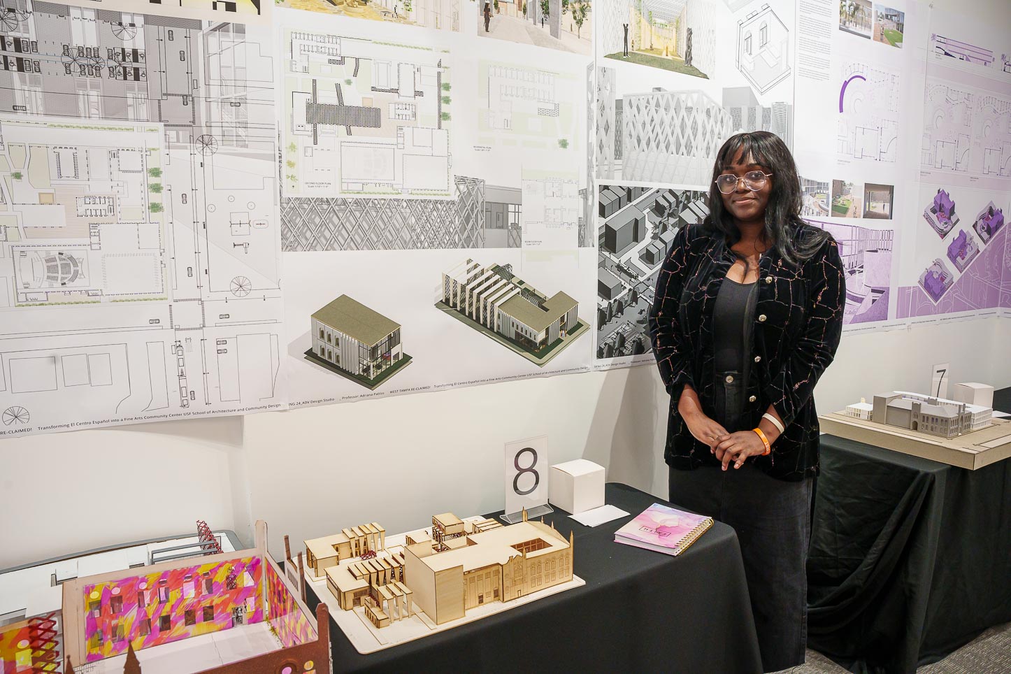 Sarah Verty poses next to her Architecture project.