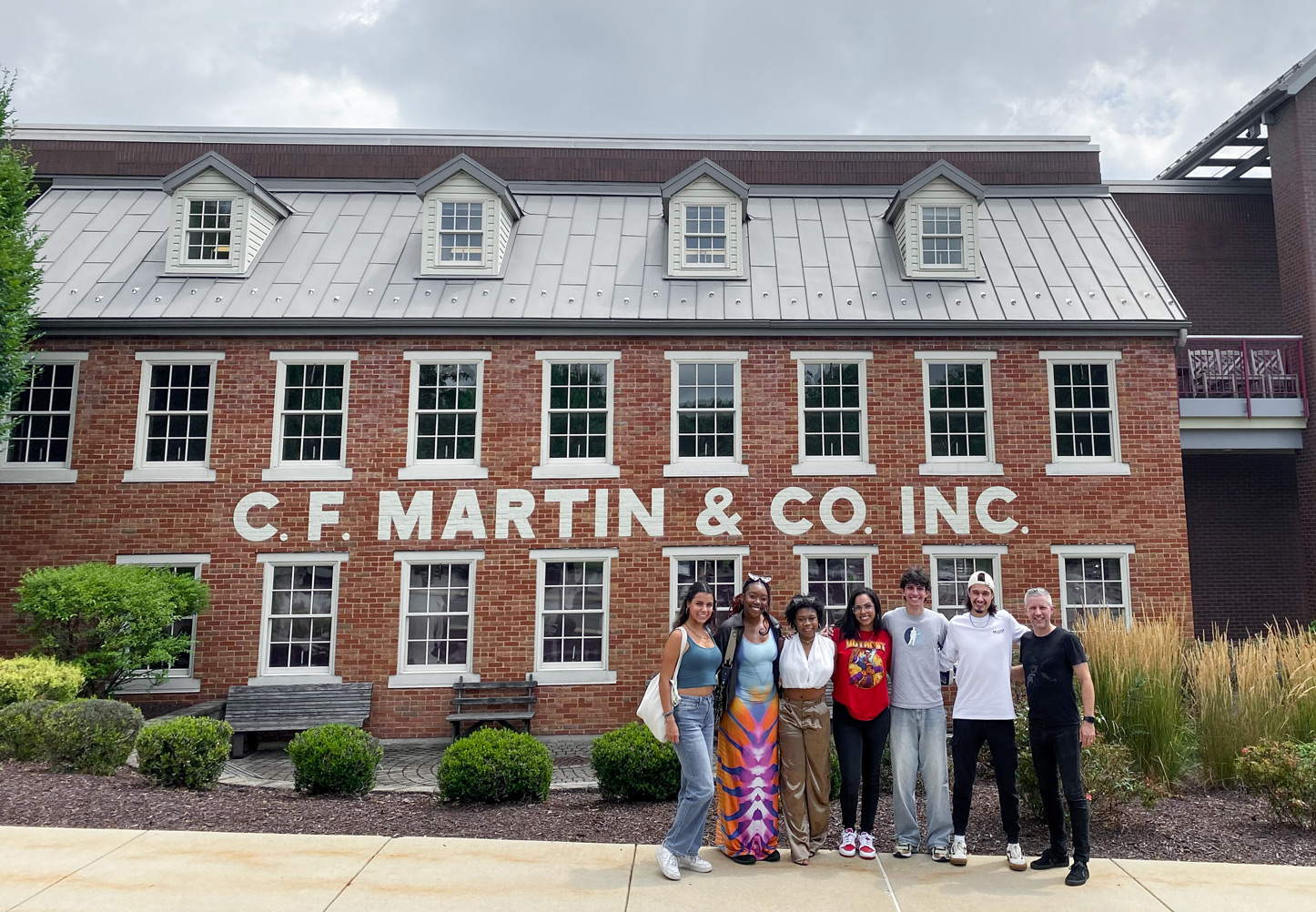 Members of the Holly Drive Collective at the C.F. Martin Guitars factory in Pennsylvania.