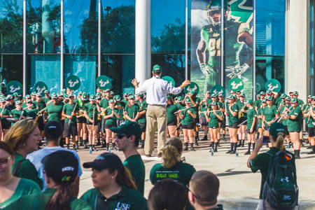 Dr. Matt McCutchen directs the band at the Homecoming game.