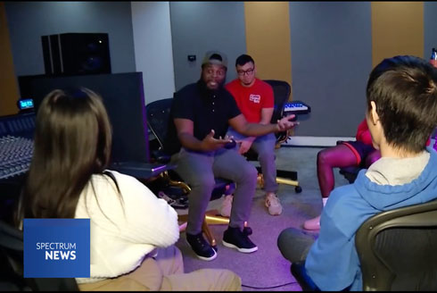 Kenrick Wagner (second from right) speaks with USF students in the Contemporary and Commercial Music program. (Spectrum News)