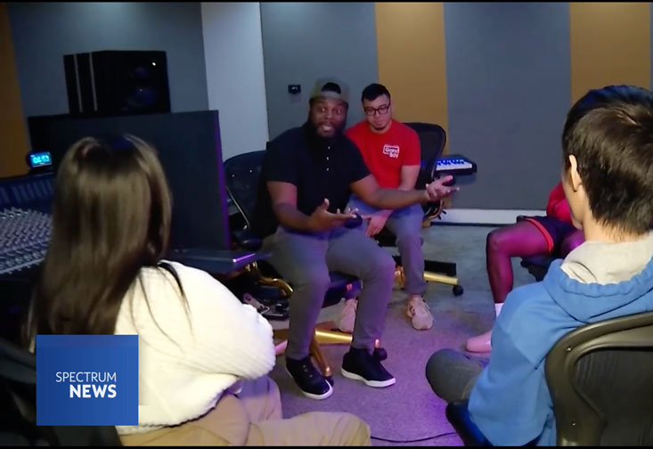 Kenrick Wagner (second from right) speaks with USF students in the Contemporary and Commercial Music program. (Spectrum News)