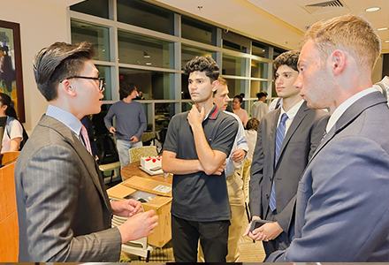 Phan socializing at an Investment Club event. 