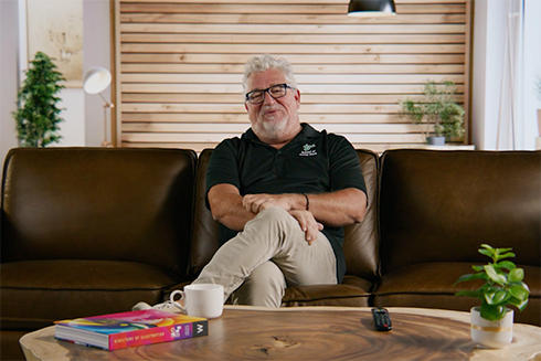 Chris Groeber sitting on couch