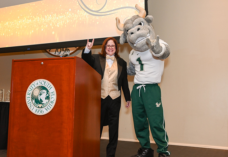 Kim Read on stage with Rocky the Bull