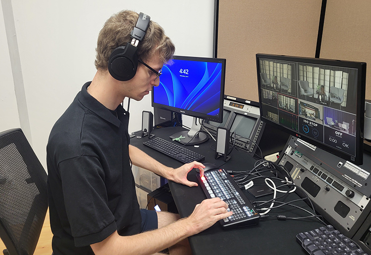 student works on a computer