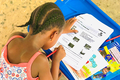 a child completes a worksheet