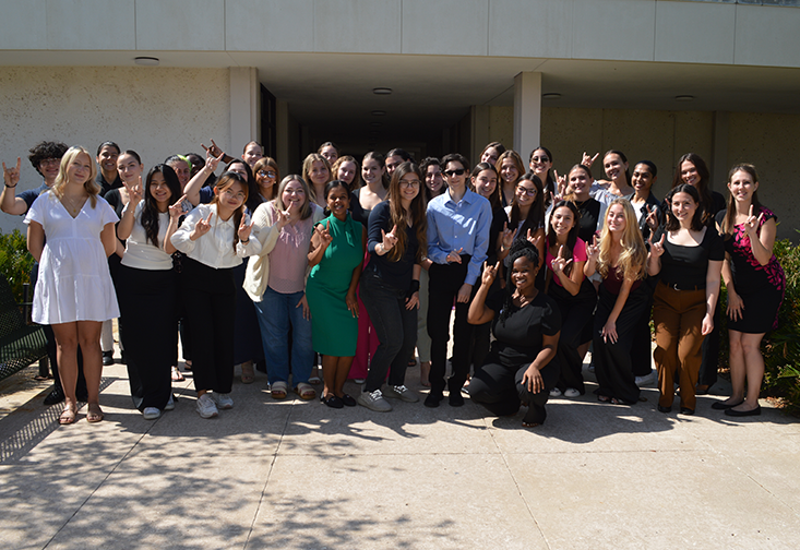 Undergraduate students in the ABA minor gather in a large group outside